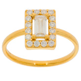 Elegant gold ring featuring an emerald-cut diamond center stone surrounded by sparkling smaller diamonds.